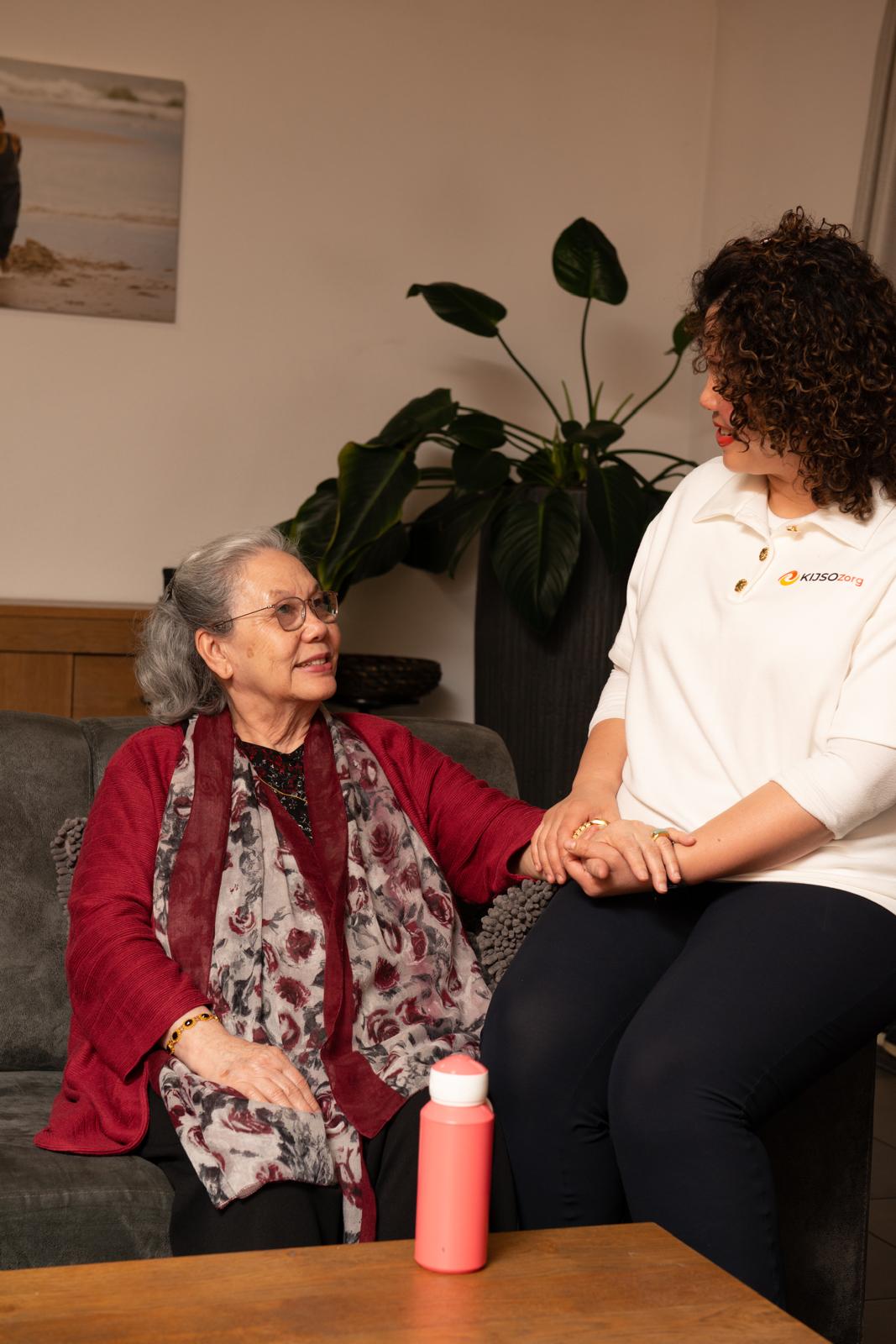 Healthcare worker helping senior
